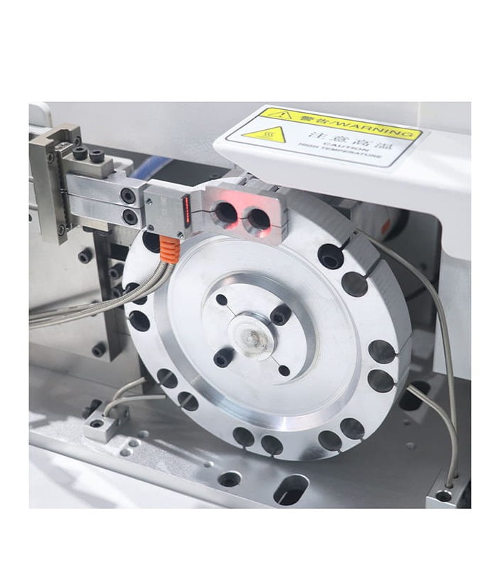 Automatic machine for inserting and heat shrinking sheaths